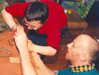 young potter and helper at Bloomin Arts pottery workshop run by Crackpots CAO