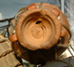 Moroccan drum made from poor quality clay showing faults in the fired body