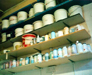 photo showing glaze materials stored in jars on shelves