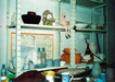 photo of the studio showing a work bench and shelves with wares in various stages of production